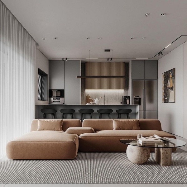 Коричневий диван у світлій вітальні