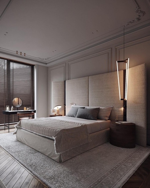 Ліжко з великим м'яким узголів'ям в сучасній спальні